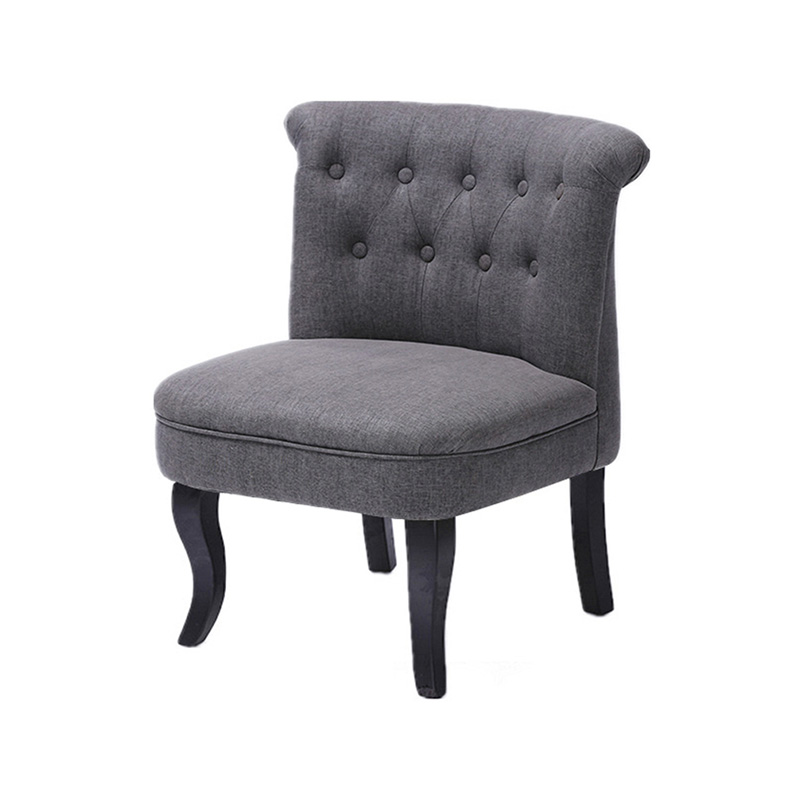 Velvet accent chair with buttons on backrest and wooden shaped legs